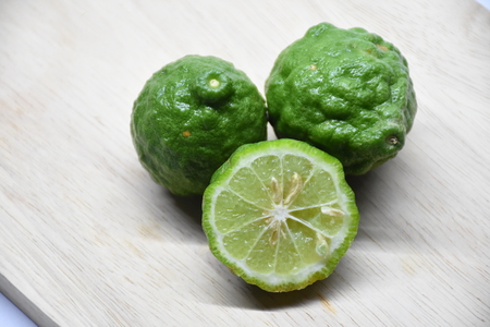 Bergamots (Other names are Kaffir lime, Citrus, Magnoliophyta, Rutaceae) fruits with leafの写真素材