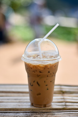 ice coffee on a wood with nature backgroundの写真素材