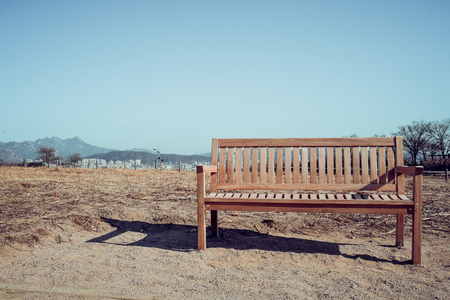 wooden bench with Mountains backgroundの写真素材