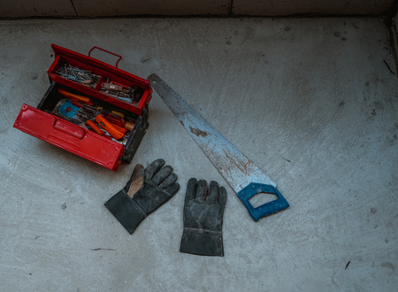 Bangkok,Thailand - March 26 ,2017 : Red metal tool box with many tools on concrete floorの写真素材