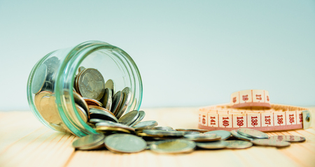 Coins in glass jar for money saving financial conceptの写真素材