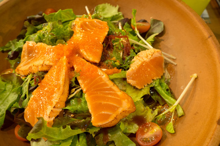 A delicious smoked salmon garden salad with smoked salmonの写真素材