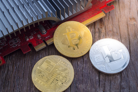 Cryptocurrency mining concept with bitcoin on a videocardの写真素材