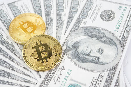 Bitcoin golden coin New virtual money and dollar backgroundの写真素材