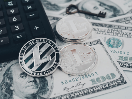 Litecoin golden coin New virtual money and dollar background .の写真素材