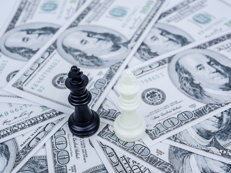 World money game by black winner chess king on international major countries banknotesの写真素材