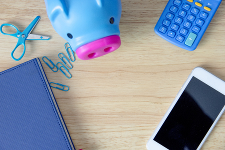 Back to school season with school and office supplies over wooden table. Top view with copy space.の写真素材