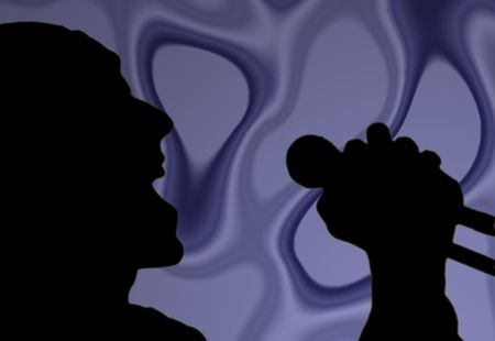 a man sings loudly into a microphoneの写真素材