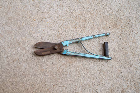 The old equipment used for cutting steel is blue.