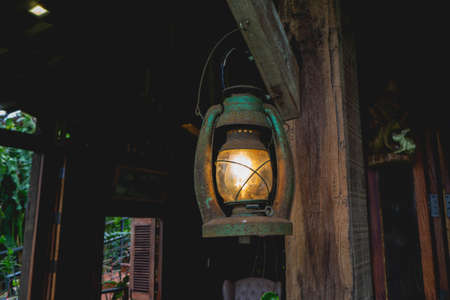 Vintage lamp with a wooden house