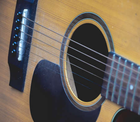 A close up acoustic guitar with yellow brown colorの写真素材