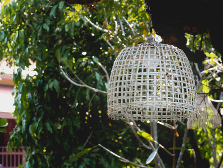 A white lamp made of woven bamboo.