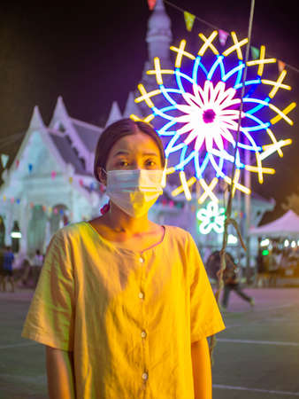 Woman and Flower arrangements at Temple name "Wat Luang Por Si La", Thungsaliam, Sukhothai, Thailand in 26 February 2021の写真素材