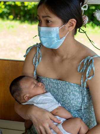 Woman and baby Asian and nationality Thai is happy feelの写真素材