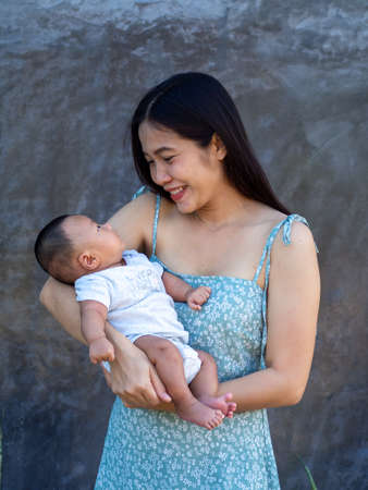 Woman and baby Asian and nationality Thai is happy feelの写真素材