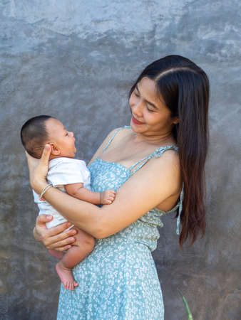 Woman and baby Asian and nationality Thai is happy feelの写真素材
