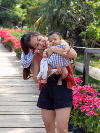 Woman and baby Asian and nationality Thai is happy feelの写真素材