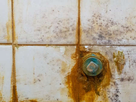 Basin lid with old stained tilesの写真素材