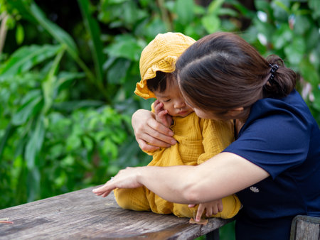 Asian mother and son of Thai nationality and nature at De mala Cafe, Thung Saliam, Sukhothai, Thailand.の写真素材