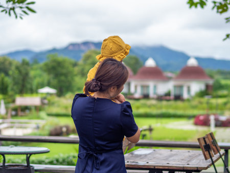 Asian mother and son of Thai nationality and nature at De mala Cafe, Thung Saliam, Sukhothai, Thailand.の写真素材