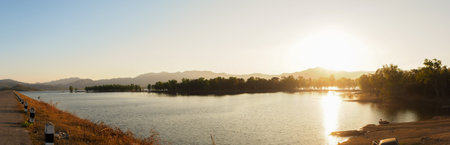 River and Lake Sunset and Sunrise with Beautiful Sky and Water Reflection at Mea Mok, Lampang,...