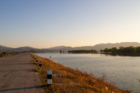 River and Lake Sunset and Sunrise with Beautiful Sky and Water Reflection at Mea Mok, Lampang,...
