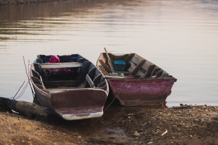 Old Fishing Boat Drifting on Riverの写真素材