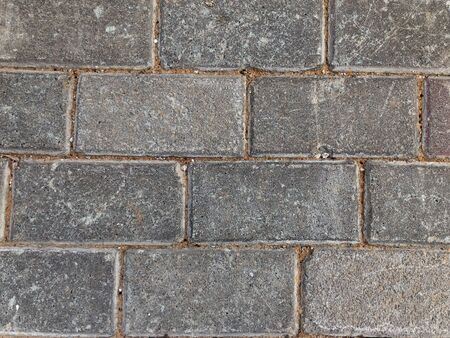 Gray paving slabs close-up. Abstract decorative background.