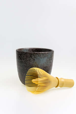 Japanese green tea matcha Chasen bamboo whisk and traditionally Japanese bowl isolated in white background.の写真素材