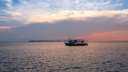 sunset with boatの写真素材