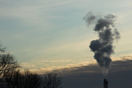 Smoke coming from a chimneyの写真素材