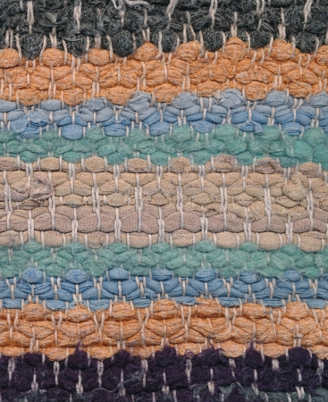 Background  - closeup old striped rag rug