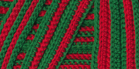 Macro red and green crochet stripes