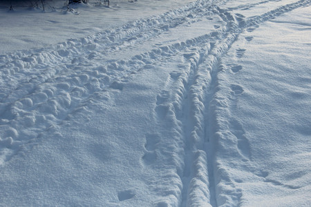 Background - snow, trails, sunlight and shadows