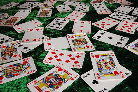 Cards scattered on green clothのeditorial素材