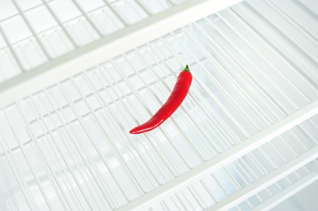 Lone chili pepper in the fridgeの写真素材