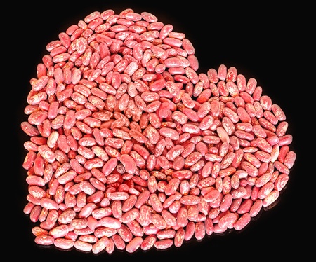 Heart symbol made of red beansの写真素材