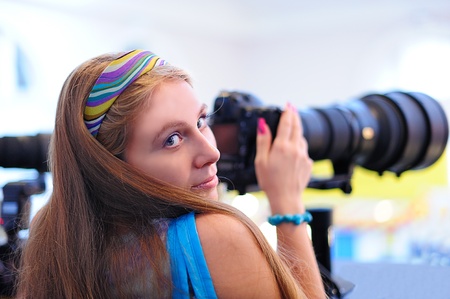 Young girl with a cameraの写真素材