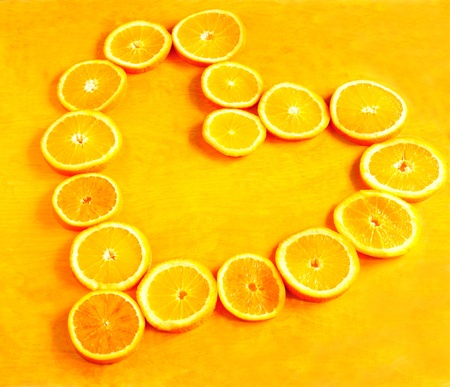 Heart made of orange ringsの写真素材