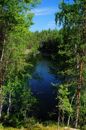 Waters of forest lake in Finlandの写真素材