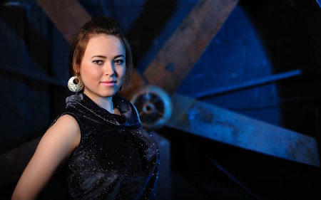 Portrait of a beautiful young girl against grunge backgroundの写真素材