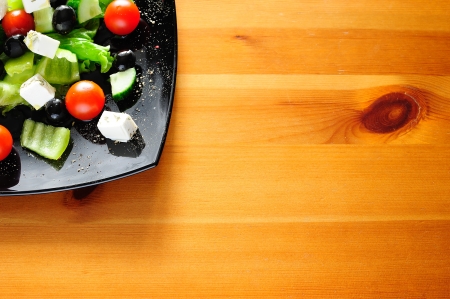 Delicious Greek salad on wooden table with copyspace for textの写真素材