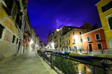 Landscape of Venice on a thunderstorm night with a flash of lightningの写真素材