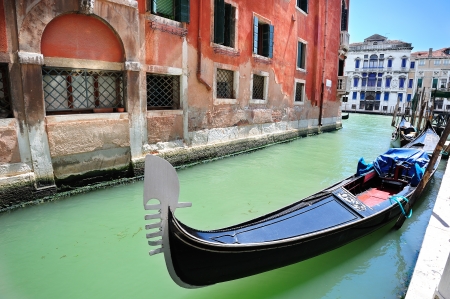 Venetian landscape with a gondola tied up to the pierの写真素材