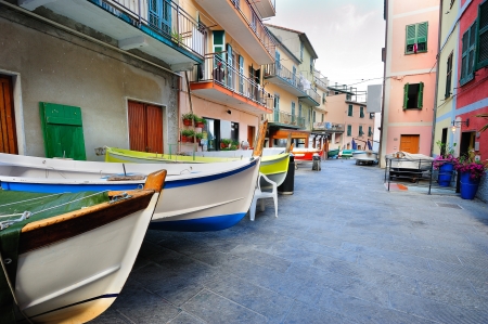 Street with fishing boats in an Italian village Manarola (Cinque Terre, Italy)の写真素材