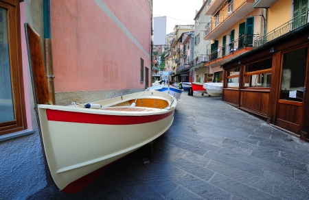 Street with fishing boats in a traditional Italian village Manarola (Cinque Terre, Italy)の写真素材