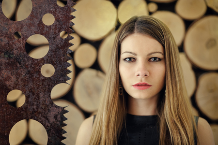 Pretty young girl on a wooden backgroundの写真素材