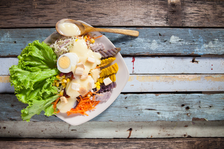 salad on plank woodの写真素材