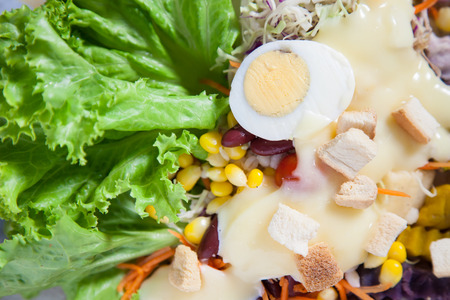 salad on plank woodの写真素材