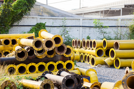 Stack of yellow steel pipeの写真素材